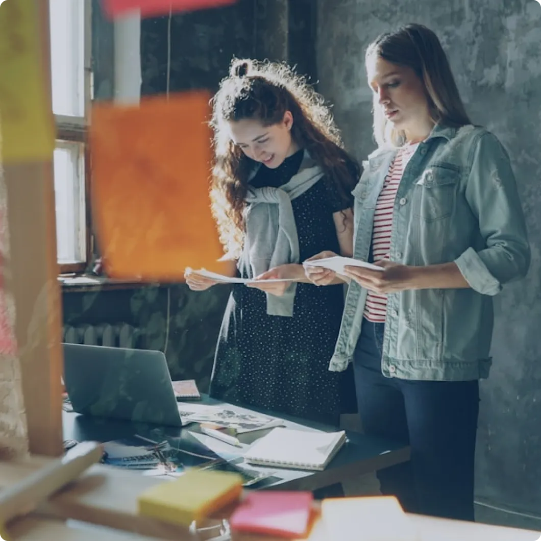 Two women working together